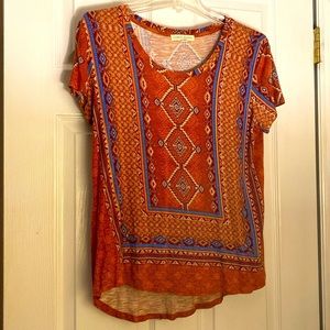 Short sleeve southwest-style patterned blouse.